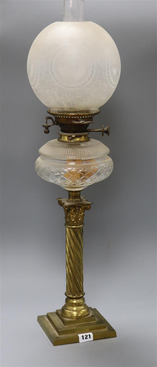 A brass oil lamp height excl. shades 51cm